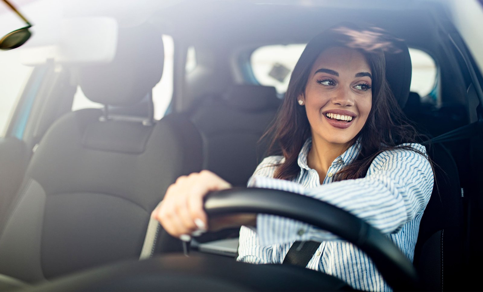 Woman driving car for title loans in Texas with JellyLoans