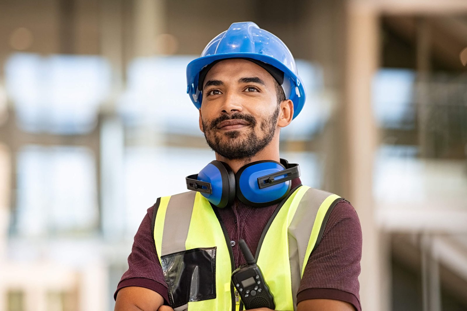 Hispanic construction worker exploring affordable Texas title loans